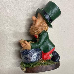 Lucky Leprechaun leaning over Crock of Gold